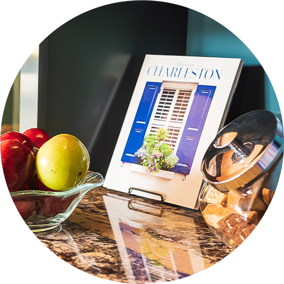 a bowl of fruit and a bowl of cookies on a counter