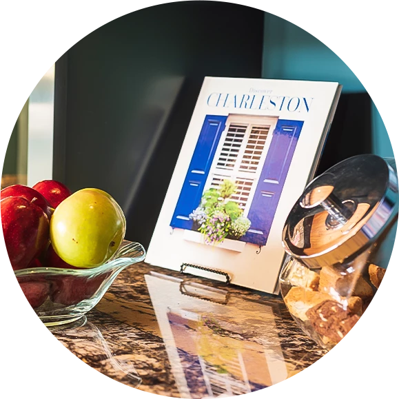 a bowl of fruit and a bowl of cookies on a counter
