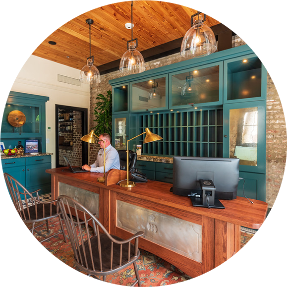 a man sitting at a desk in a hotel
