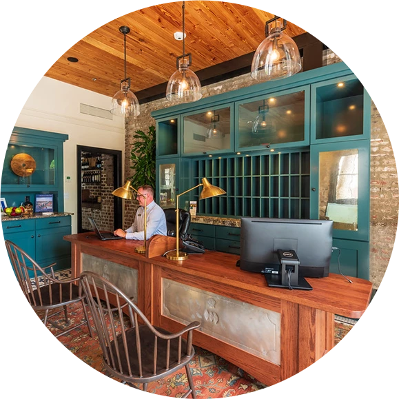a man sitting at a desk in a hotel