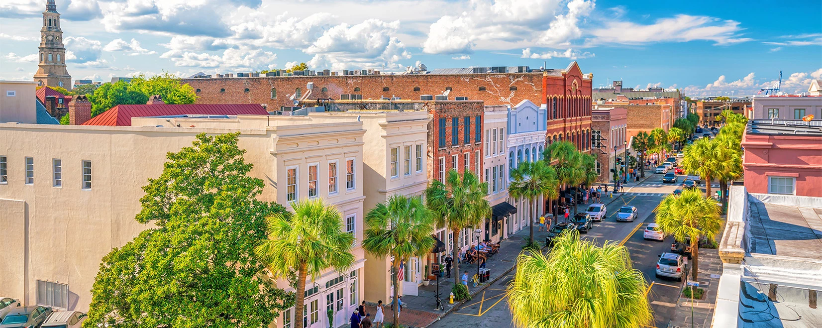 a street with palm trees and buildings