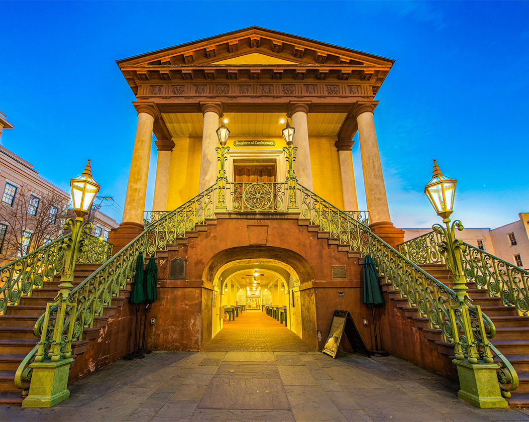 a building with a green railing