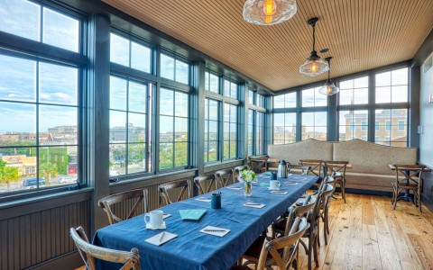 a large table set up on the solarium