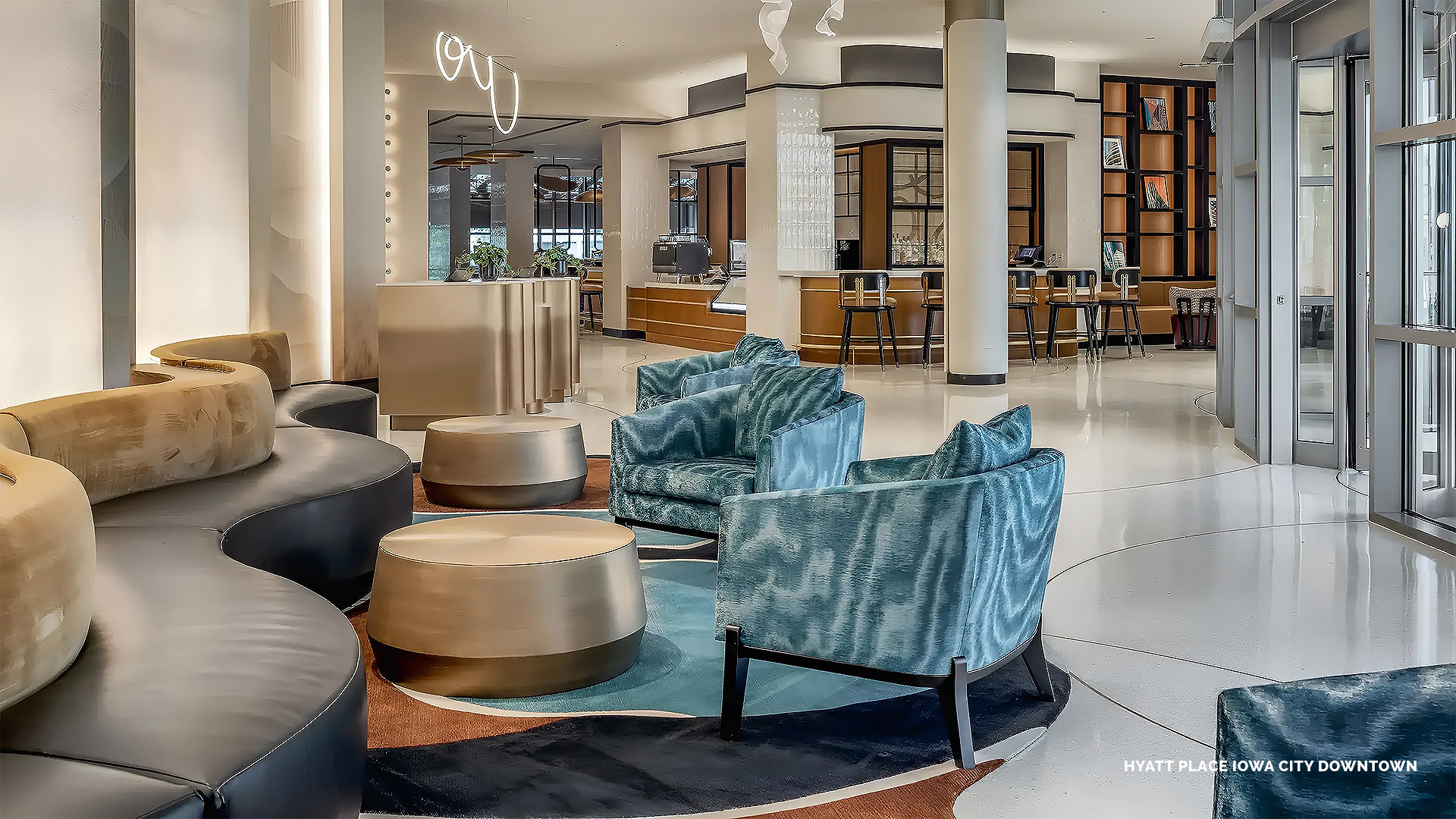 a lobby with chairs and tables