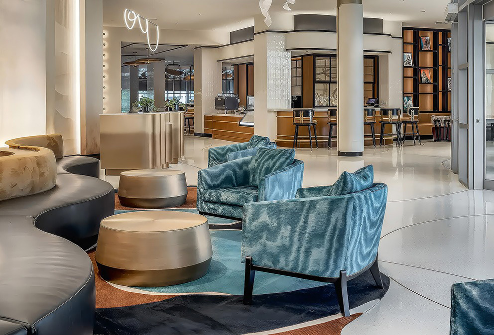 a lobby with chairs and tables