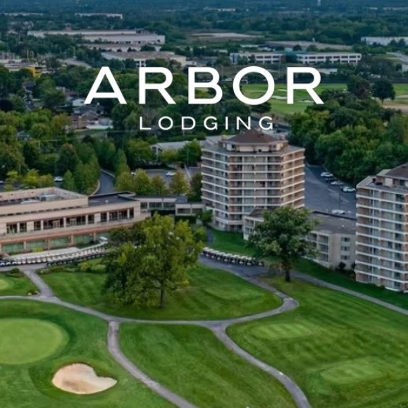 a golf course with a golf course and buildings