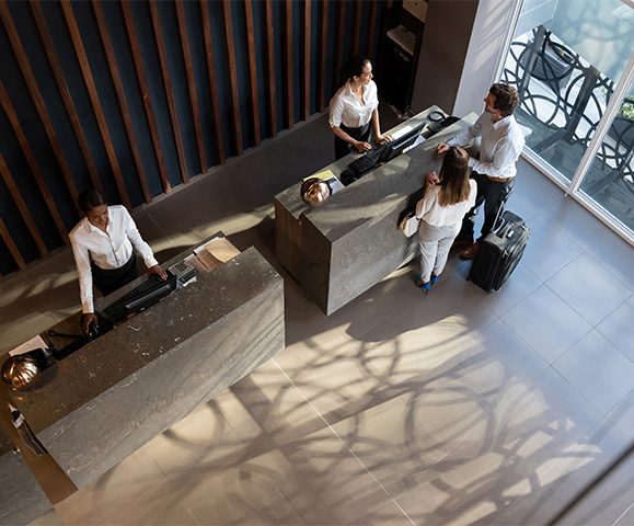 a group of people standing at a counter