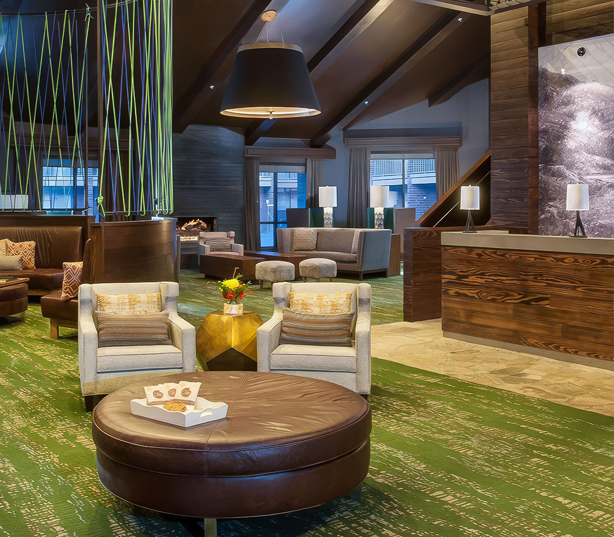a room with a reception desk and chairs