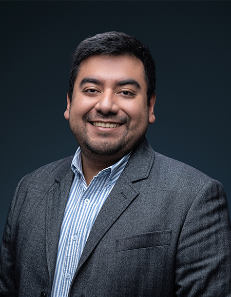 a man in a suit smiling