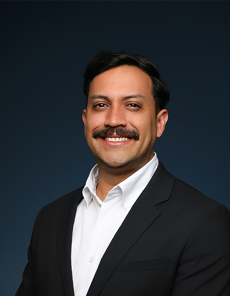 a man with a mustache smiling