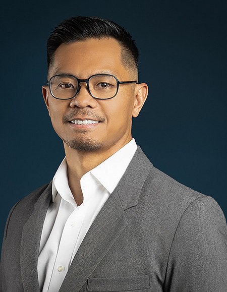 a man in a suit and glasses