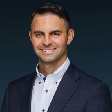 a man in a suit smiling