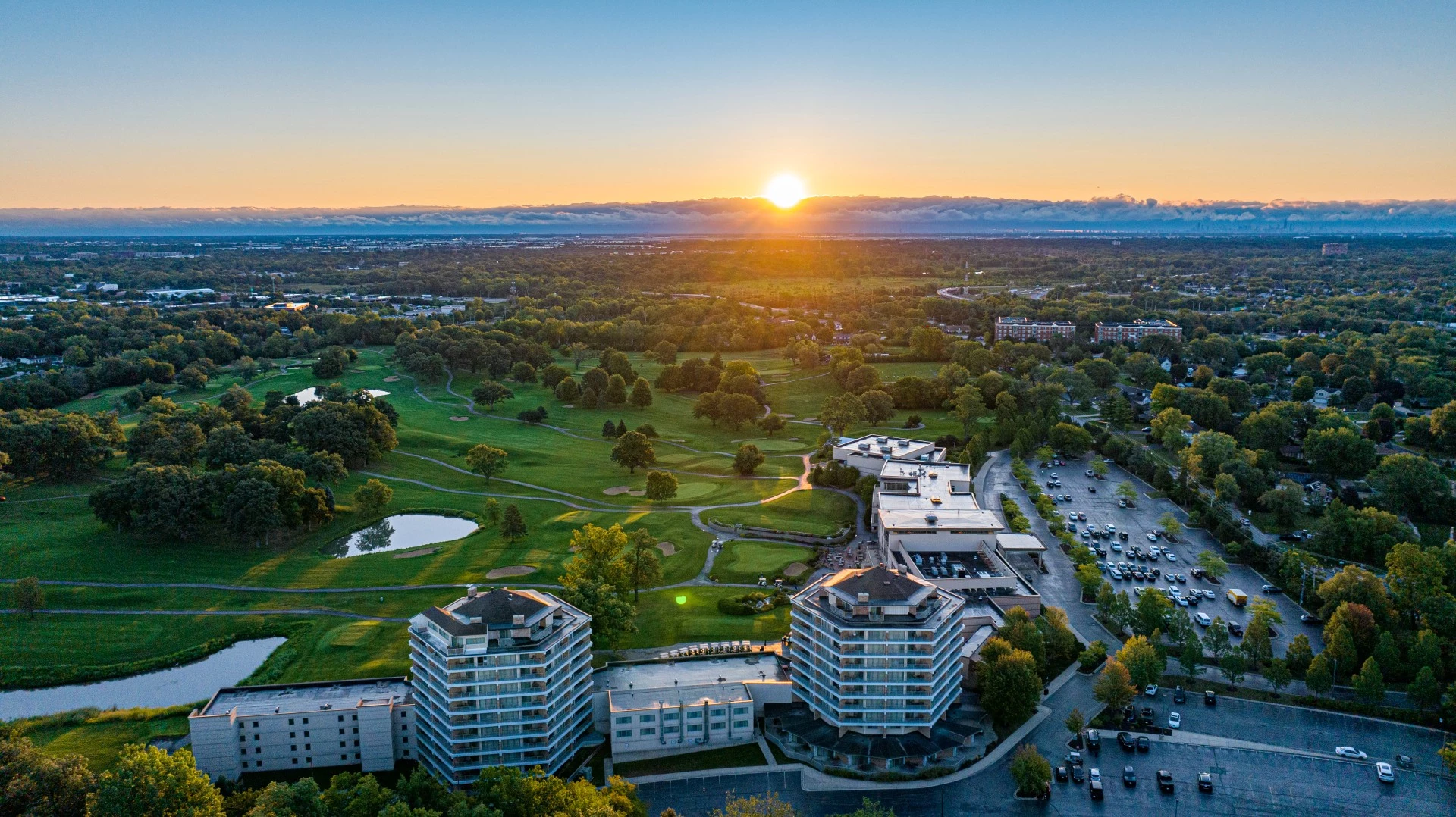 a sun setting over a city