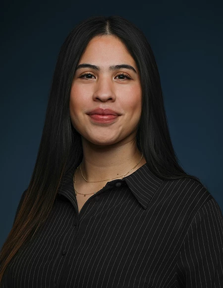 a woman with long hair wearing a black shirt