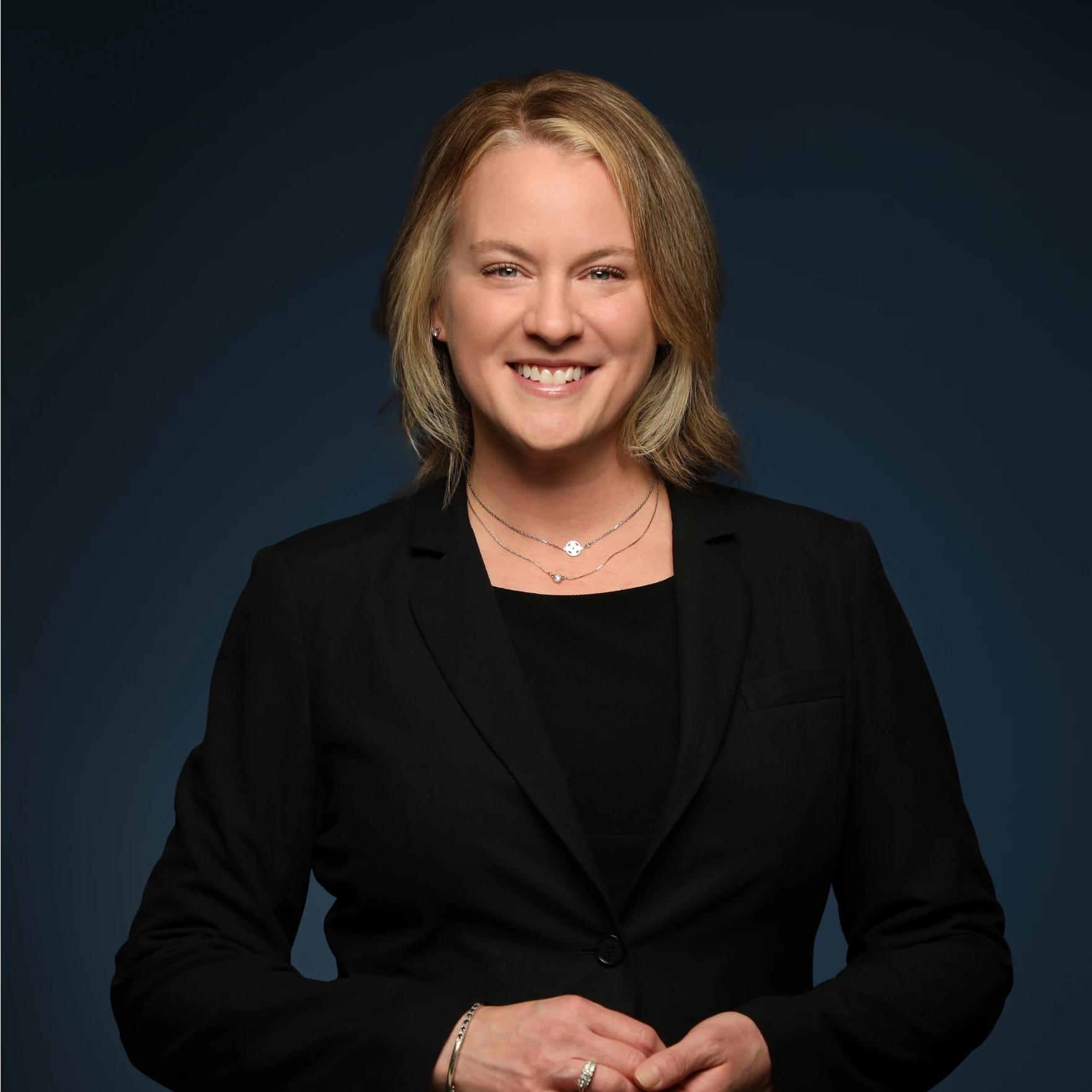 a woman in a black suit
