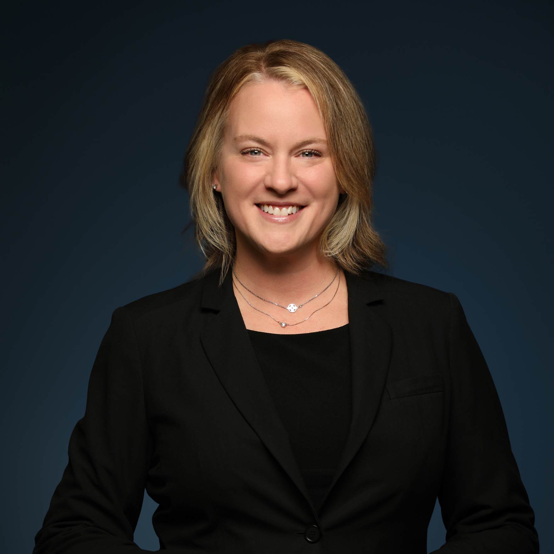 a woman in a black suit