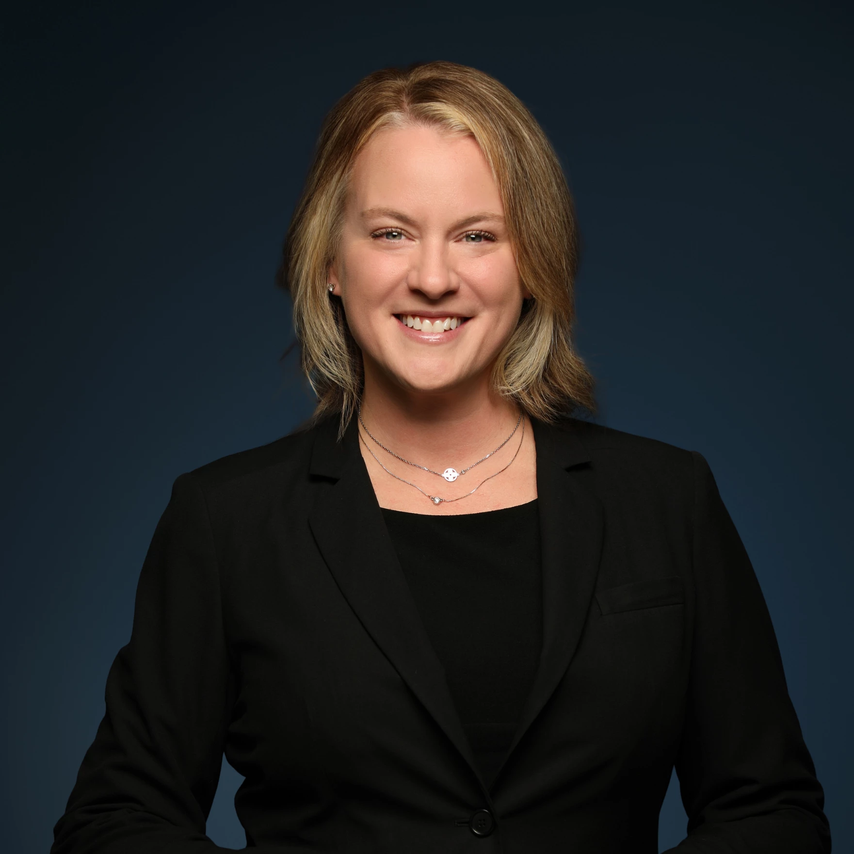 a woman in a black suit