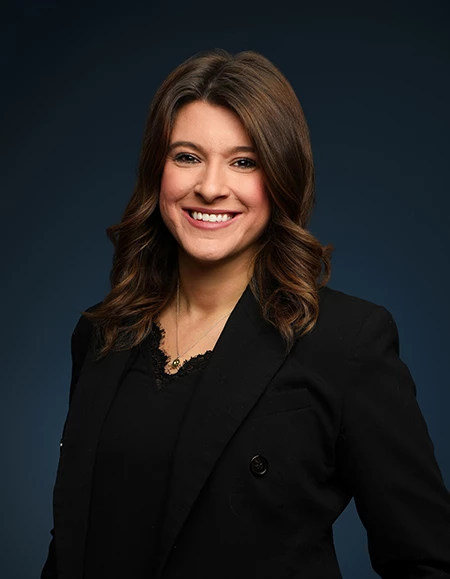 a woman in a black suit