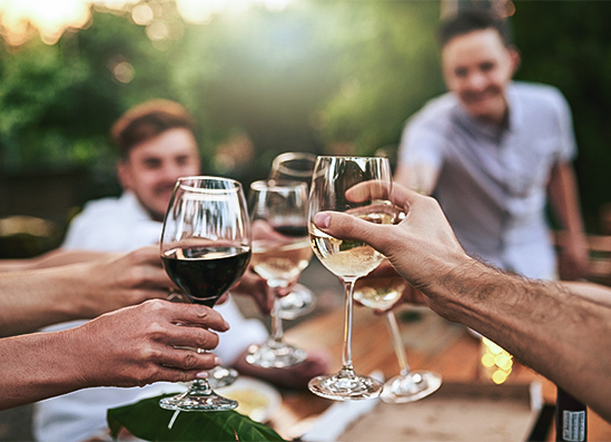 a group of people holding wine glasses