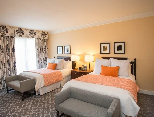 double queen with two beds and couches