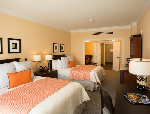 double bedroom with two bed and dark furniture