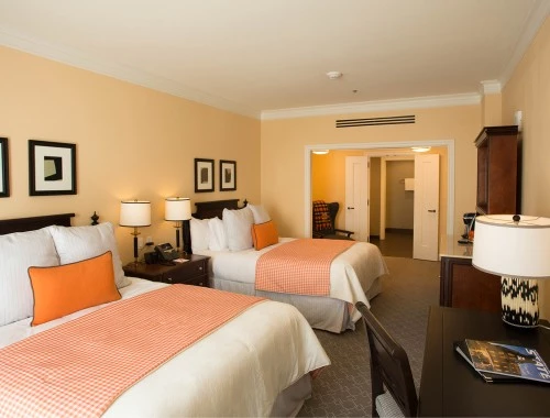 double bedroom with two bed and dark furniture