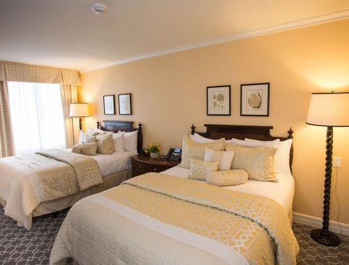 double bedroom with floor lamps and dark furniture