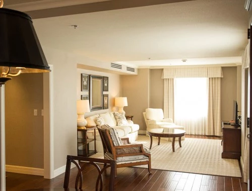 side view of living room with white seating