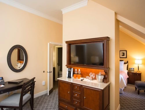 guest room with wall divider and view from the living room of the bedroom