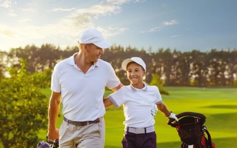 father and son golfing