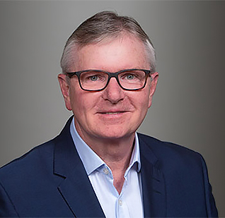 a man in a suit and glasses