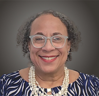 a woman wearing glasses and a necklace