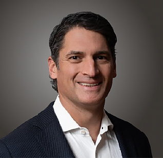 a man in a suit smiling