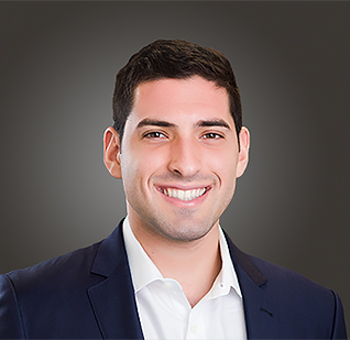 a man in a suit smiling