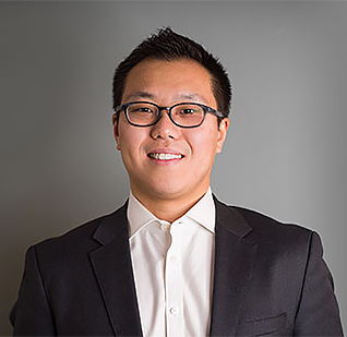 a man in a suit and glasses