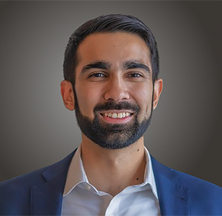 a man with a beard smiling