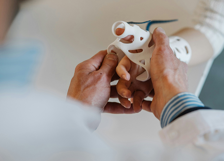 a person holding a finger splint