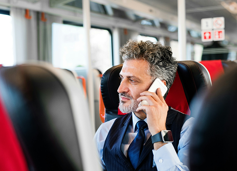 a man in a suit talking on a phone