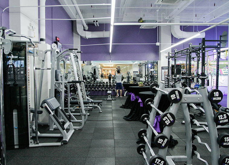 a room with many exercise equipment