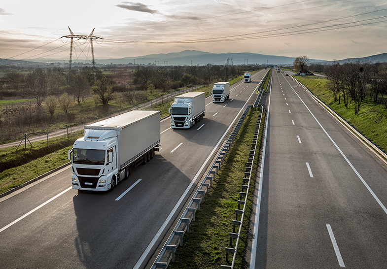 a group of trucks on a highway