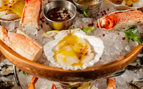 a bowl of seafood on ice