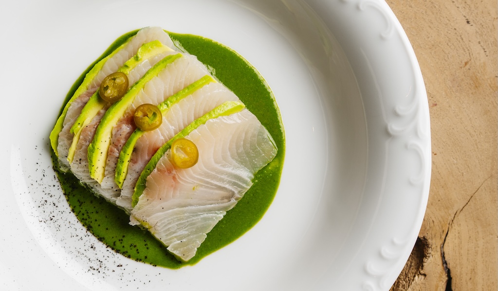 a plate of food on a wood table
