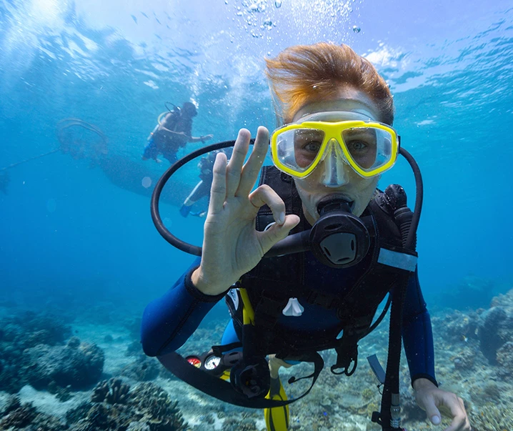 scuba diver giving the ok sign