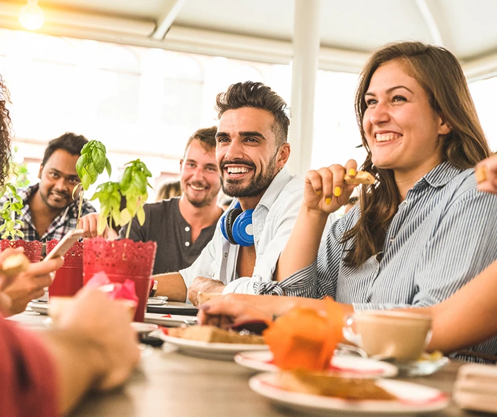 people laughing over food