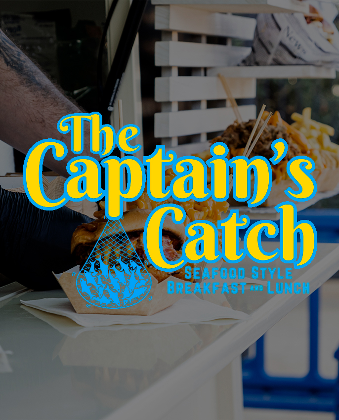 a person holding a sandwich