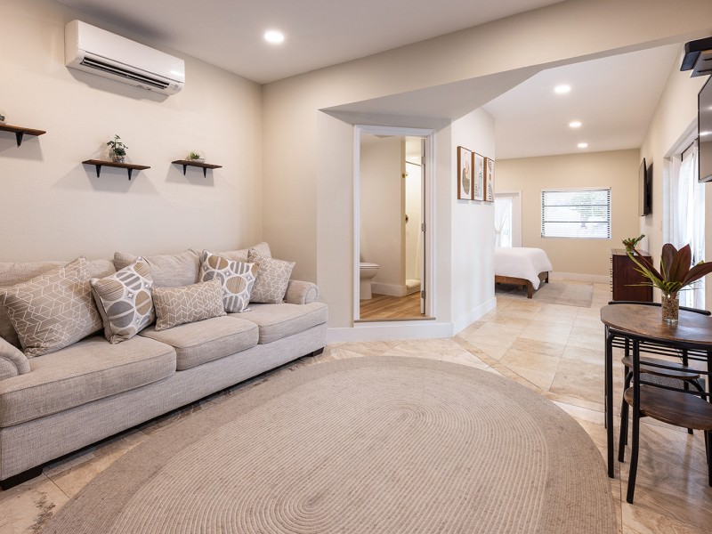 a living room with a couch and a rug