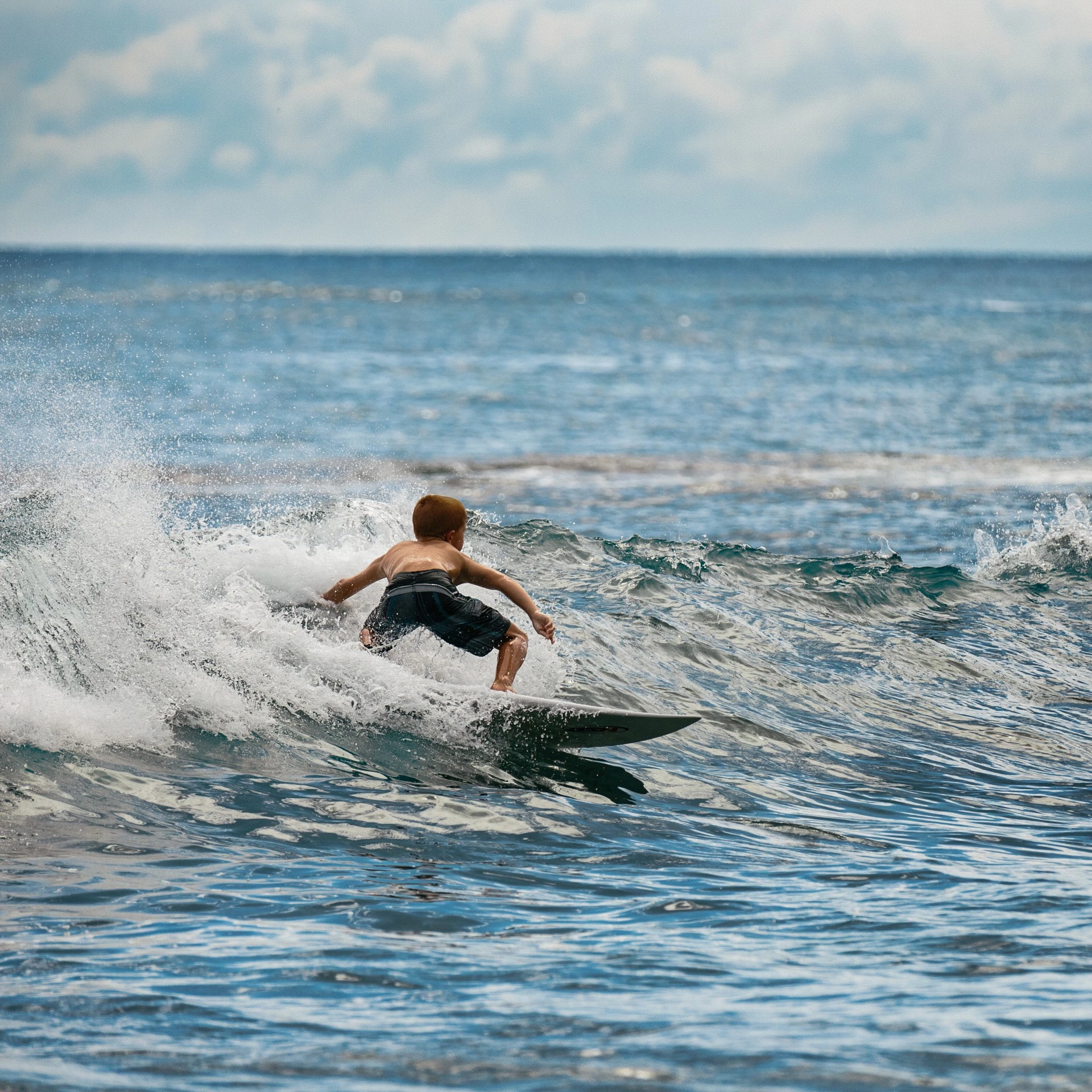 a person surfing on a wave