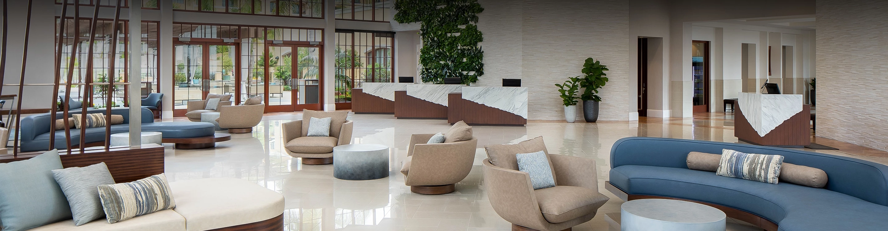 a room with a couch and chairs