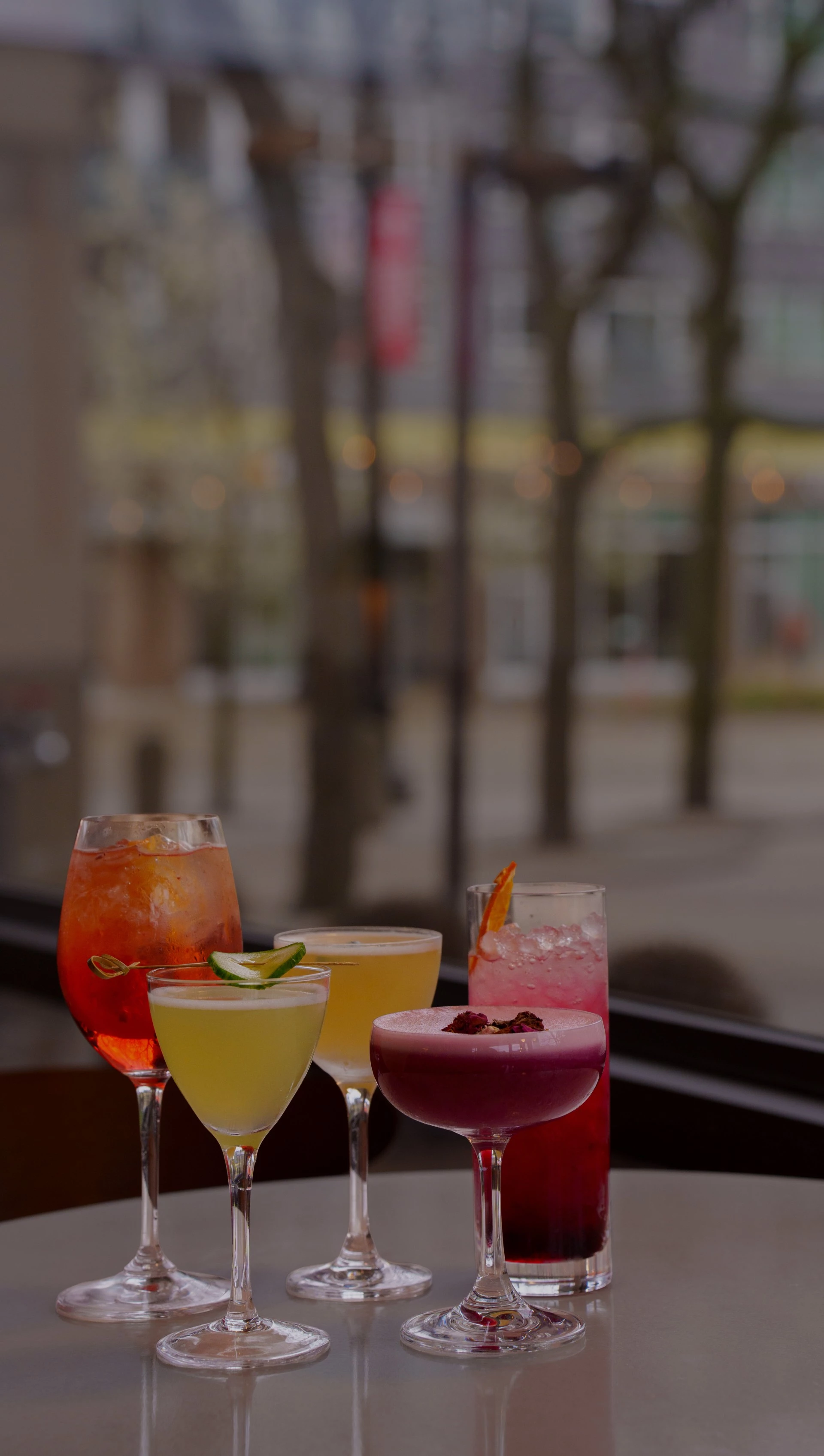 a group of different colored drinks