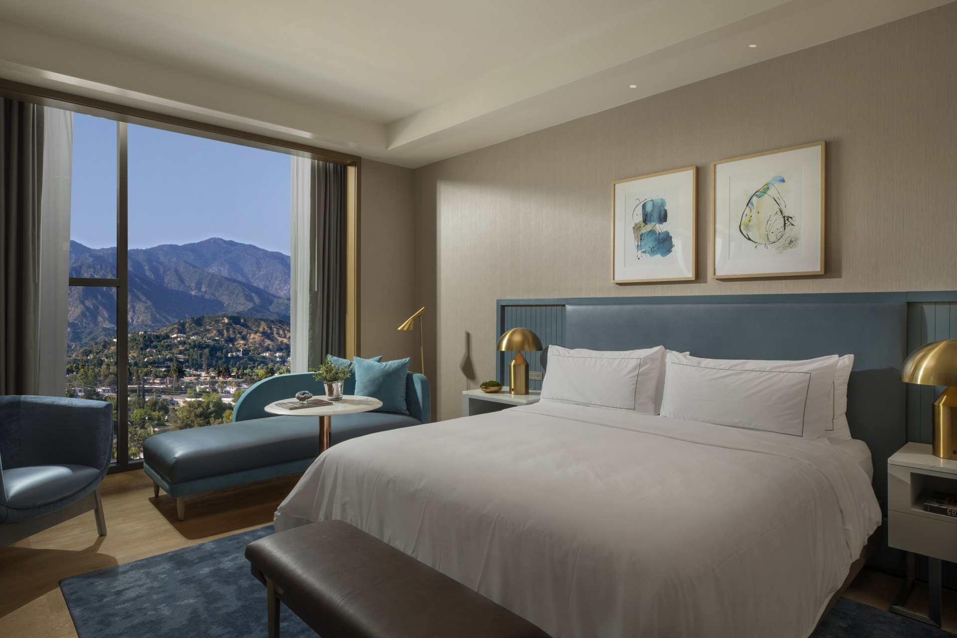 a bedroom with a bed and a table and chairs